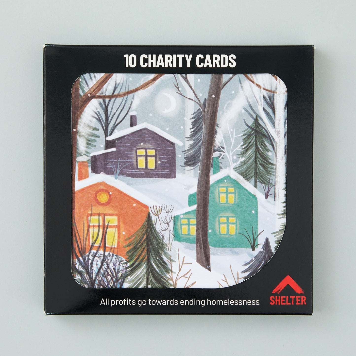 Pack of 10 'Nordic Village' Christmas cards in a black Shelter branded card box.