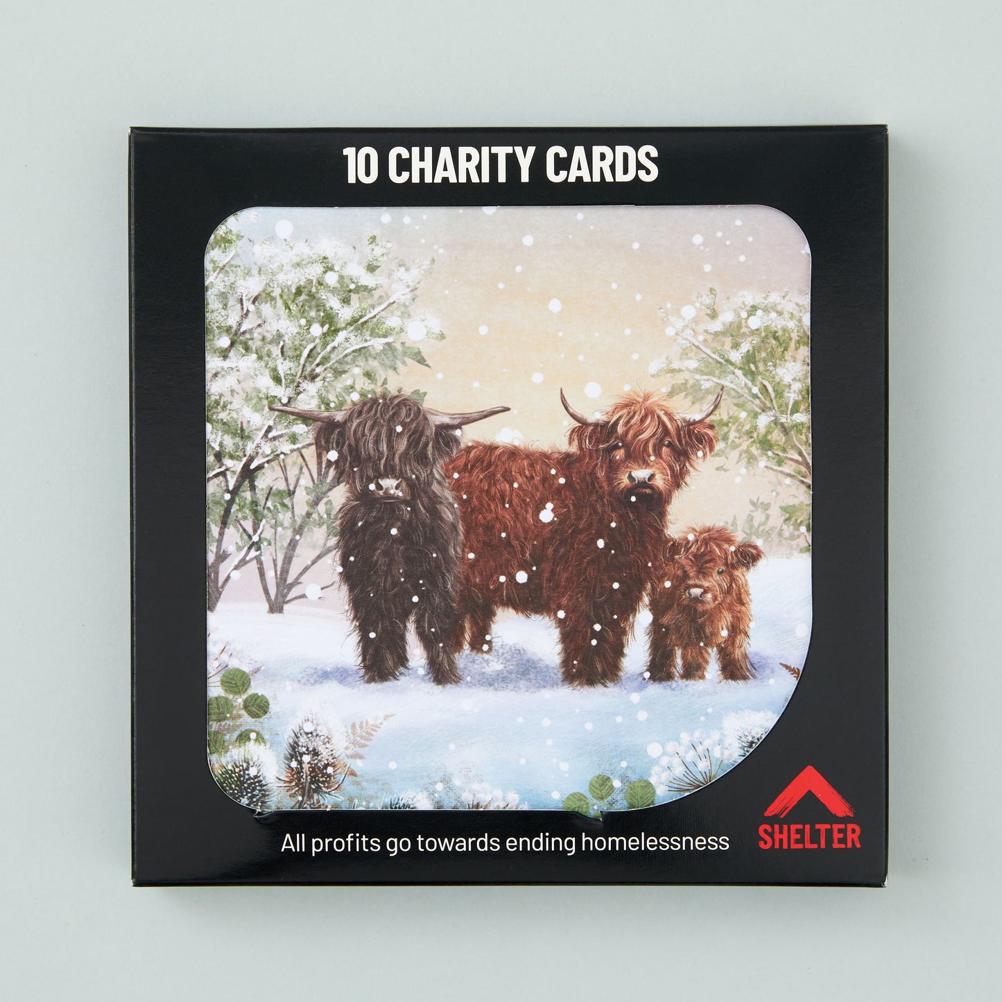 Pack of 10 'Highland Herd' Christmas cards in a black Shelter branded card box.