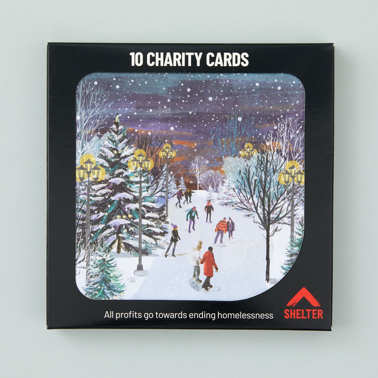 Pack of 10 'Skating on the Stream' Christmas cards in a black Shelter branded card box.