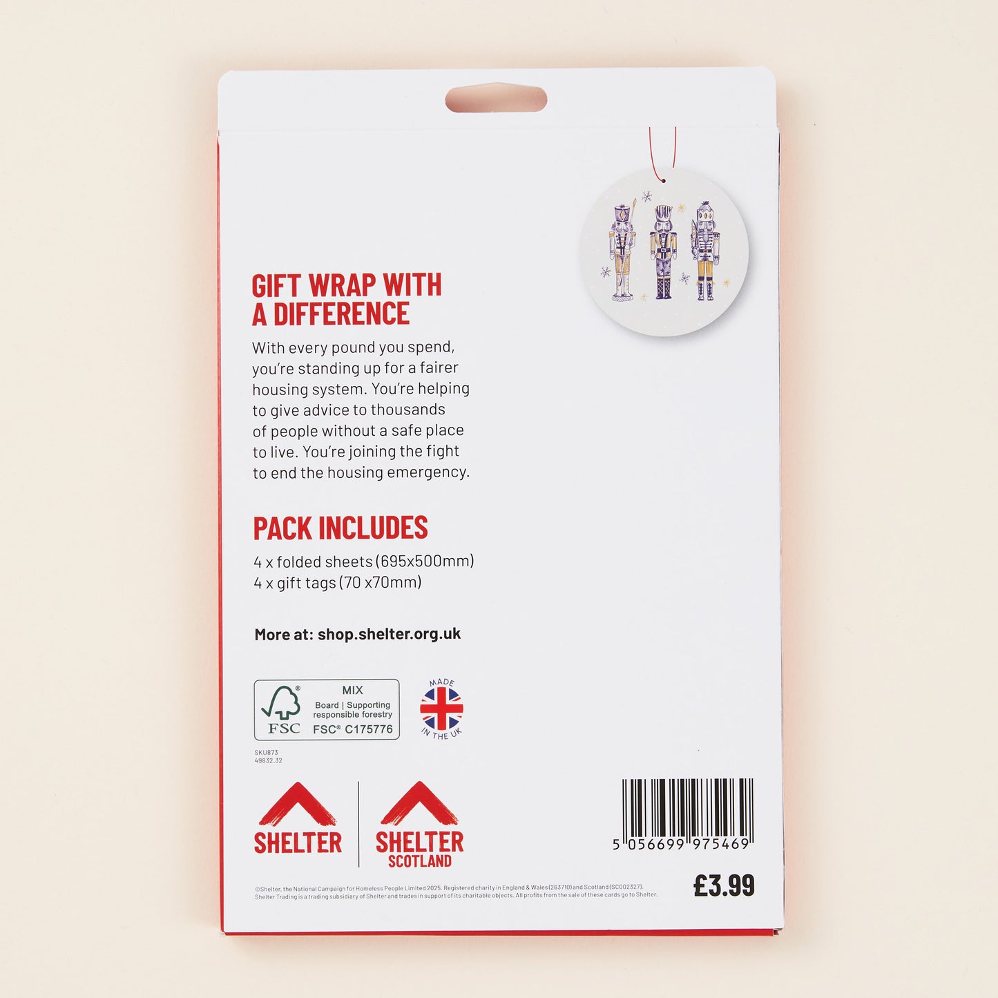 Back of gift wrap packaging with Shelter branding on a beige background