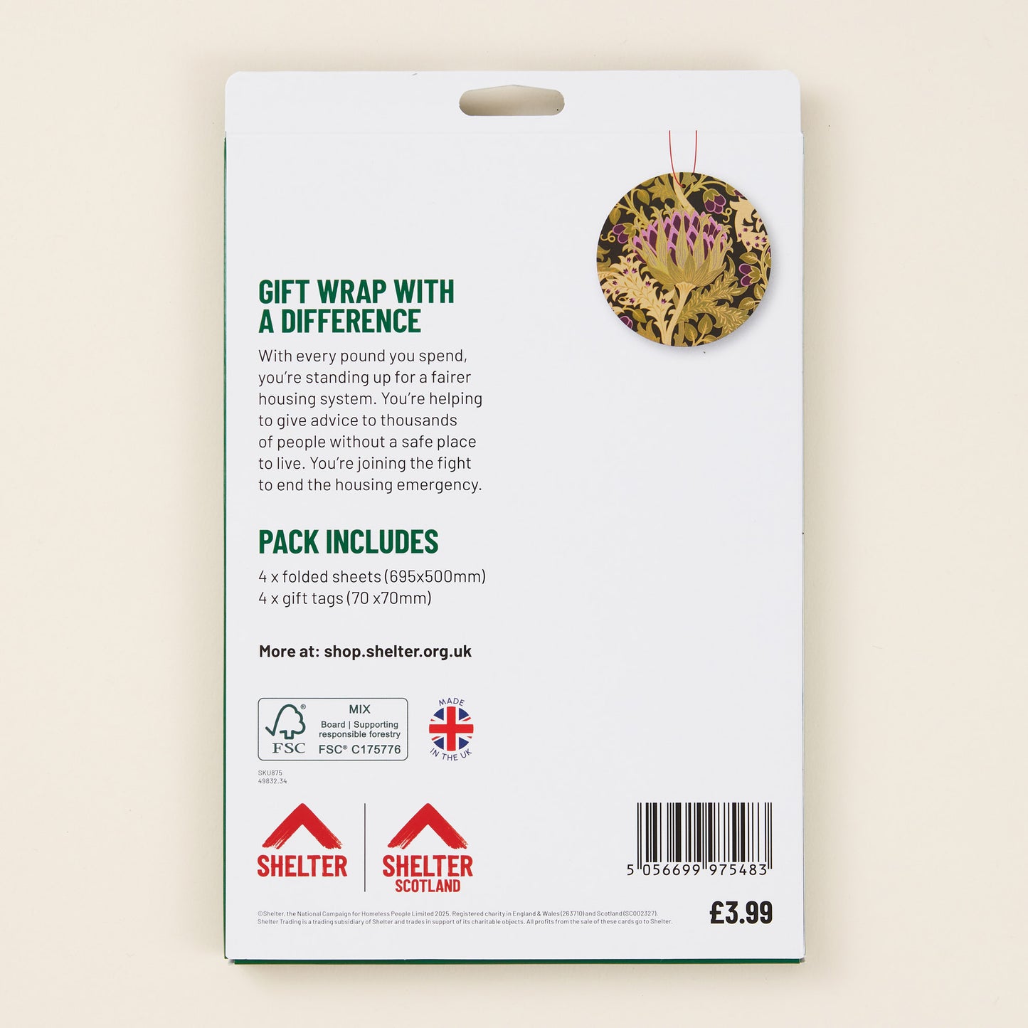 Gift wrap packaging with Shelter branding and information on a beige background