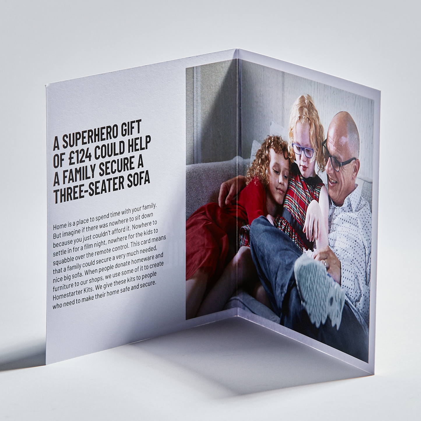 Inside of card with text and image of a man and his grandchildren reading