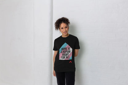 Home is a Human Right for All Black T-shirt, t-shirt design is a house shape filled with trans flag colours with black bold slogan "Home is human right for all"
