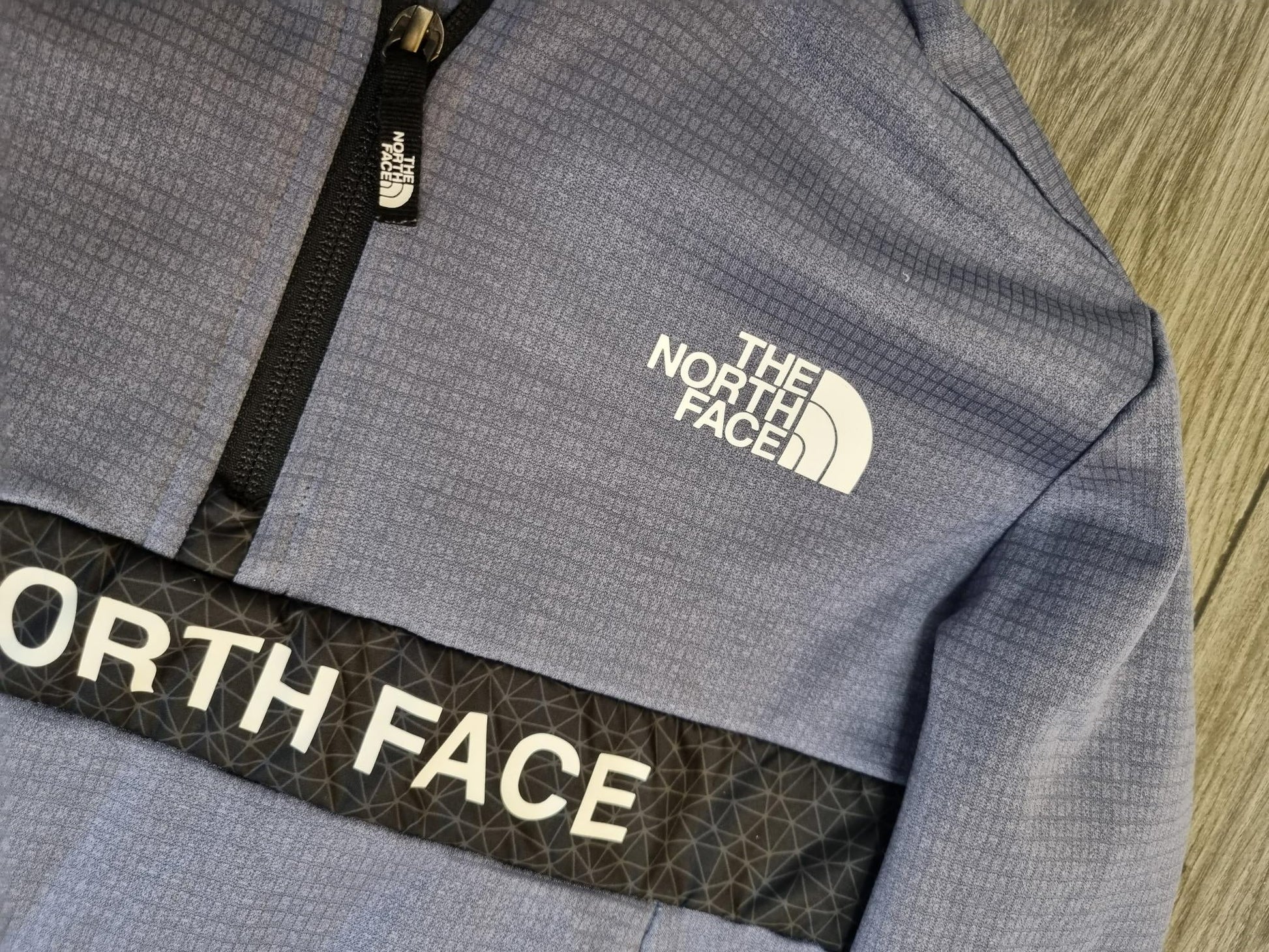 blue and black north face hoodie