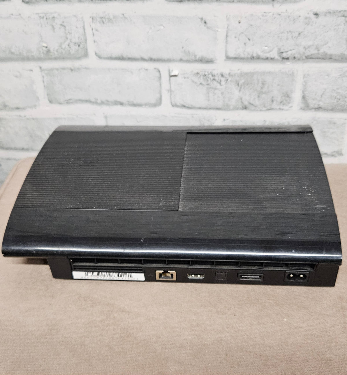 Sony PlayStation 3 PS3 Super Slim 500GB Console with Official Controller and Third-Party Second Controller