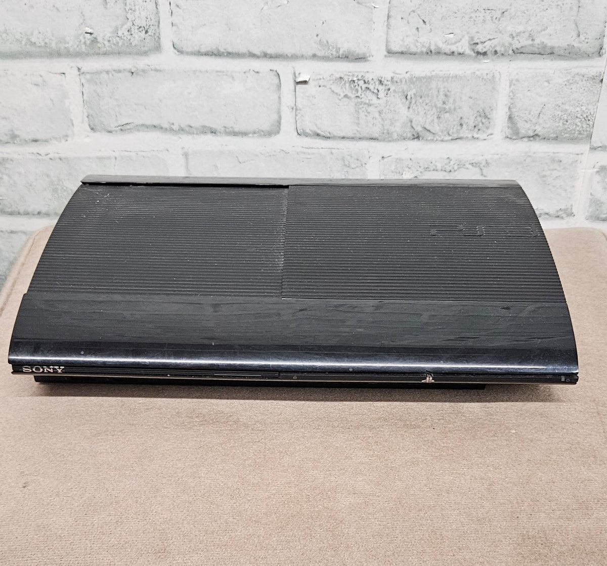 Sony PlayStation 3 PS3 Super Slim 500GB Console with Official Controller and Third-Party Second Controller