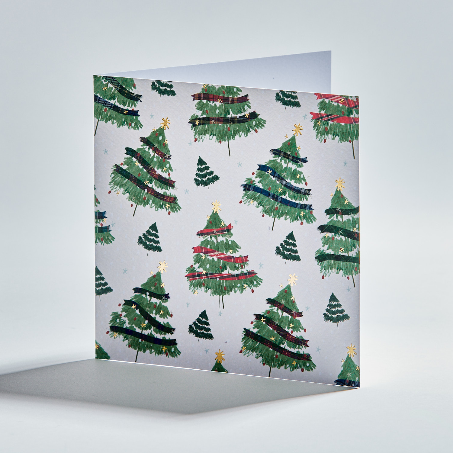 Standing christmas card depicting christmas trees with tartan decorations