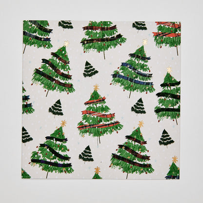 Flat lay of christmas card depicting christmas trees with tartan decorations