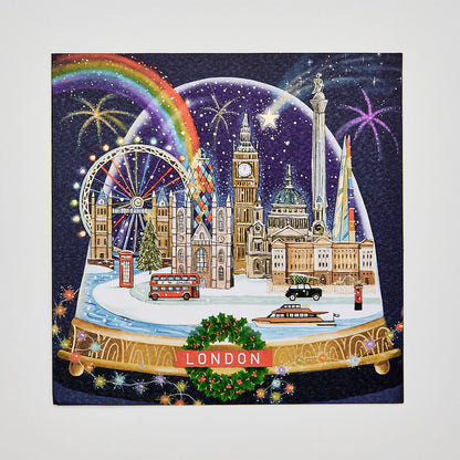 Flat lay of christmas card depicting london city snowglobe scene