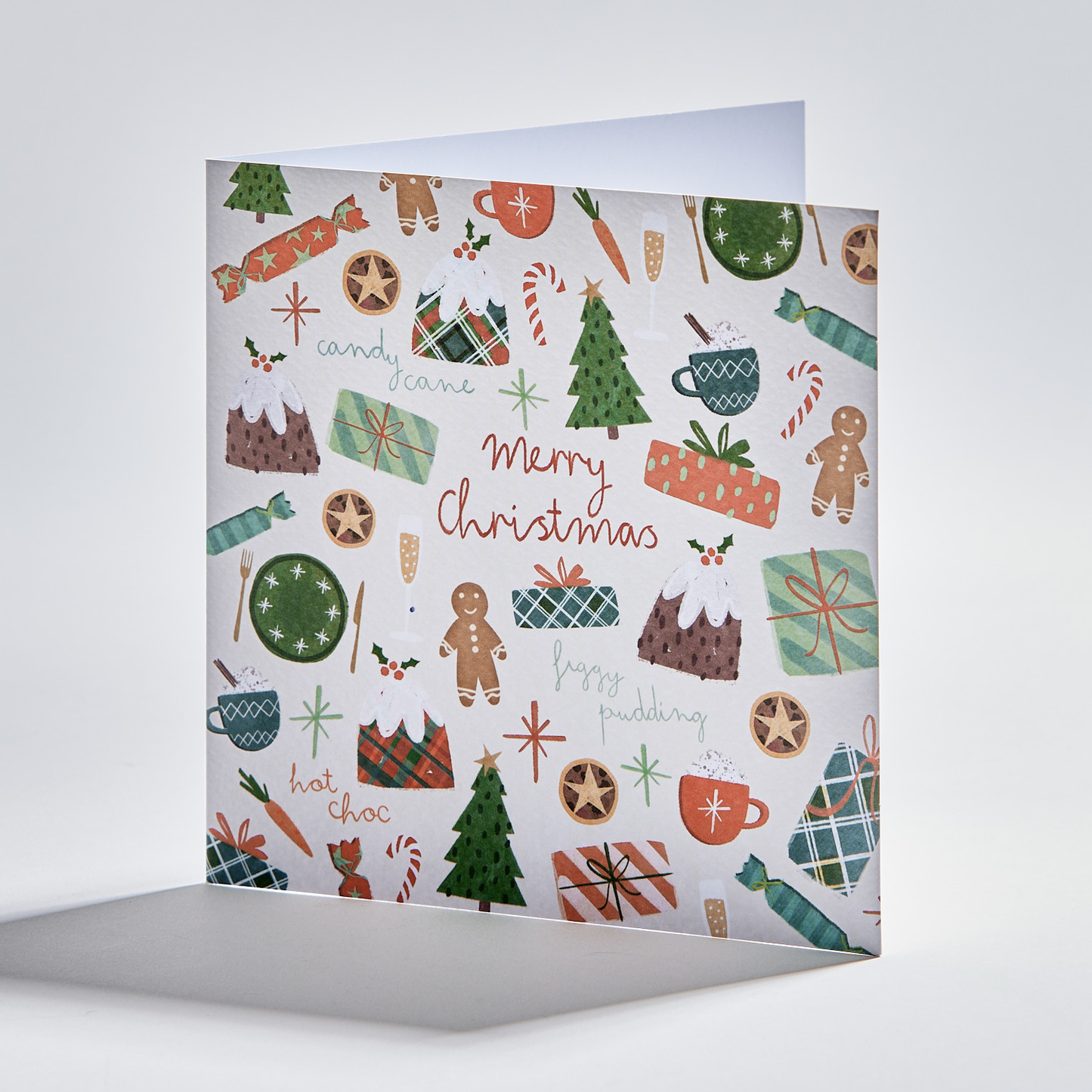 flat lay christmas card depicting festive foods. text reads 'merry christmas'