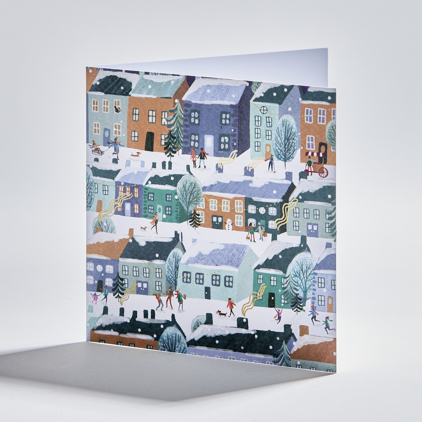 standing christmas card depicting people in snowy festive streets