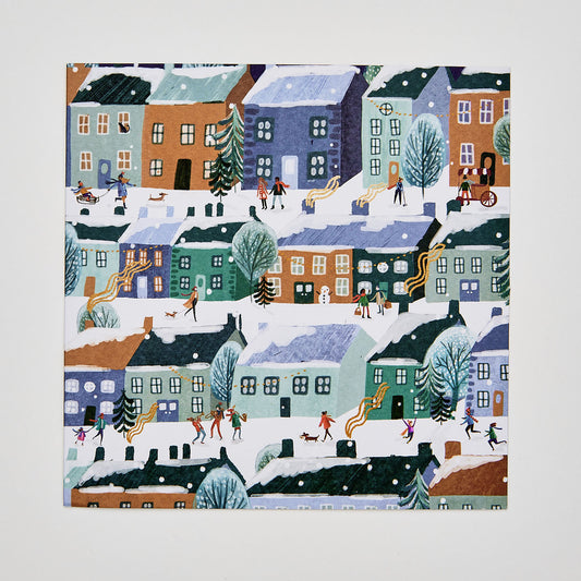 flat lay christmas card depicting people in snowy festive streets