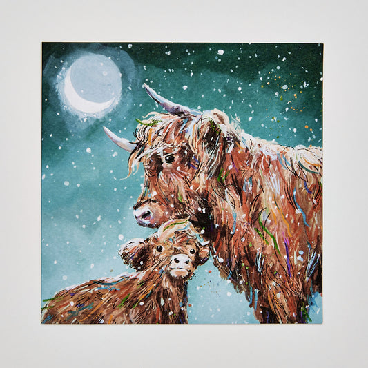 flat lay christmas card depicting highland cows under a snowy moonlit night
