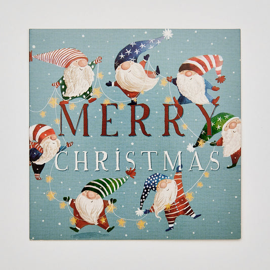 flat lay christmas card depicting santa's elves with text that reads 'merry christmas'