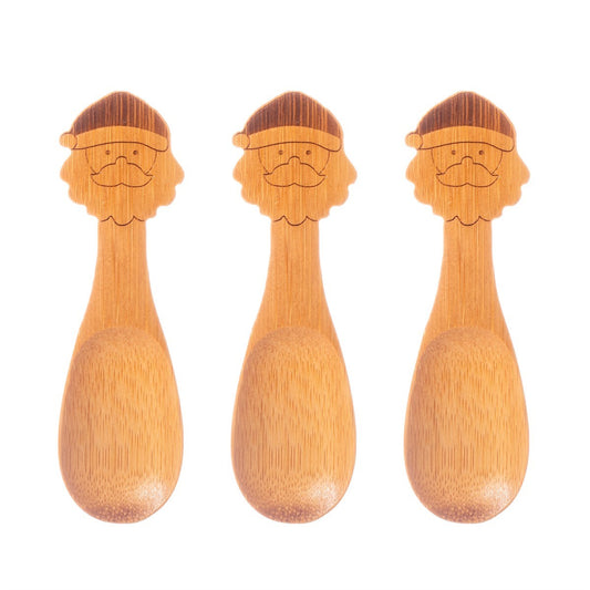 Bamboo small childrens spoons with santa faces at the holding end