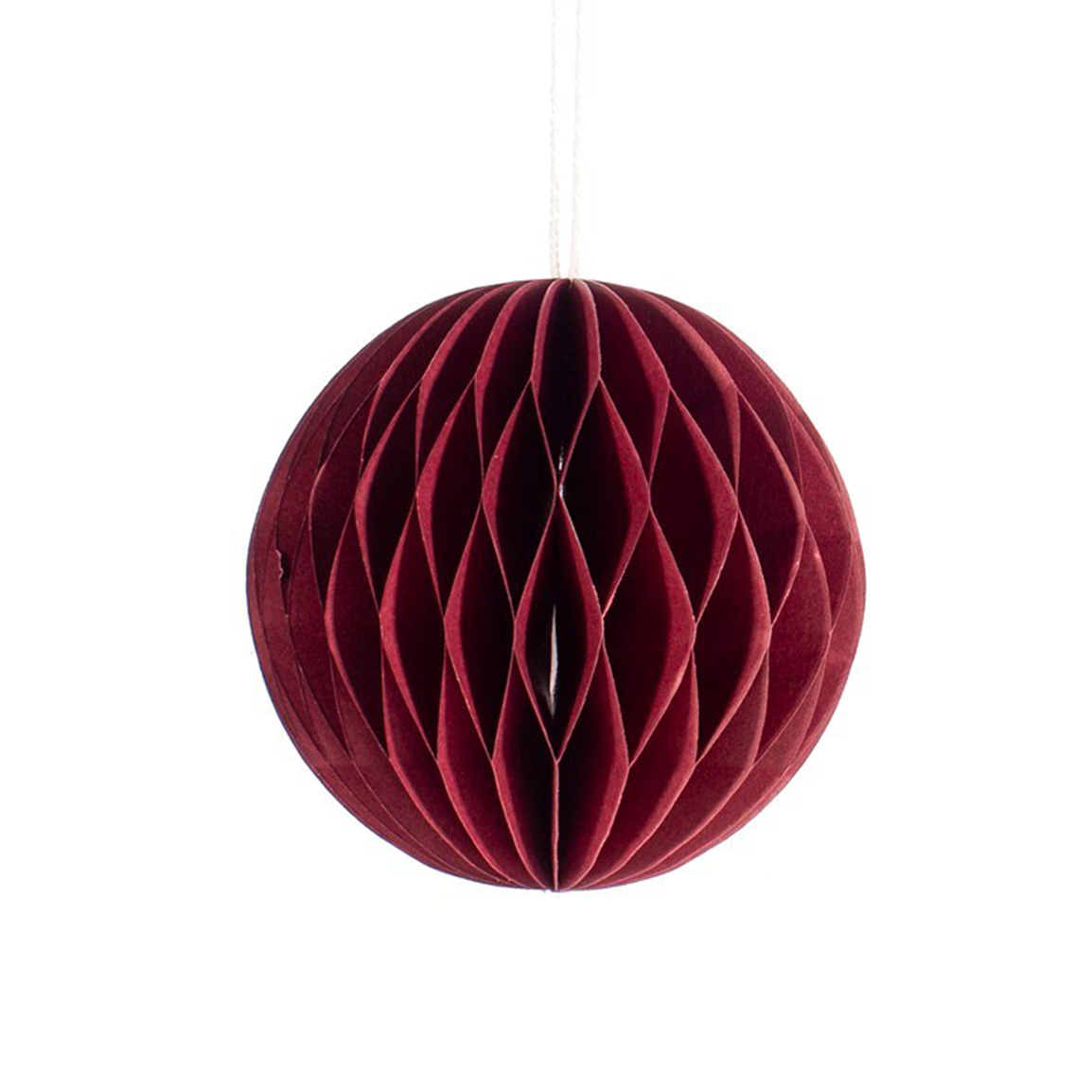 dark red paper hanging decoration in the shape of a circle. Hanging from string, honeycomb inside.