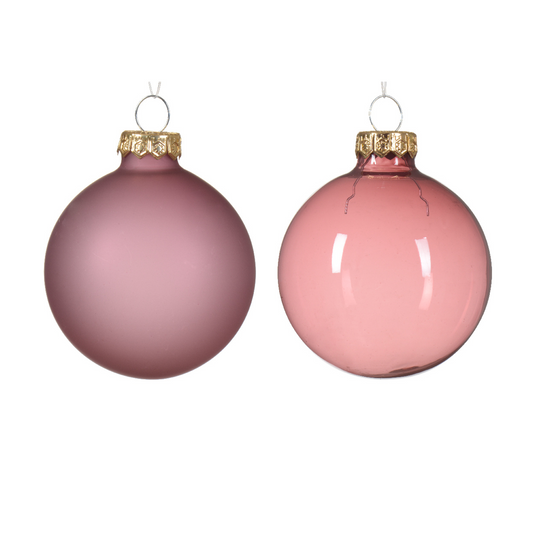 This image shows a matte and shiny velvet pink bauble. Made out of glass not velvet.