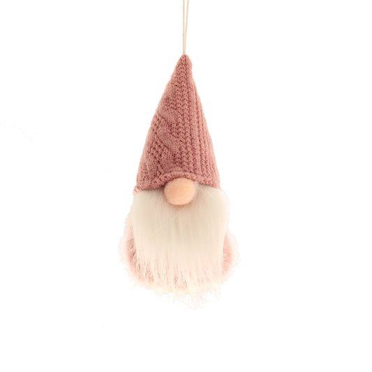 A small pink 'gonk'; a small character wearing a pink knitted pointy hat that covers its face, with a round nose, and a long white beard and a pink fluffy body.
