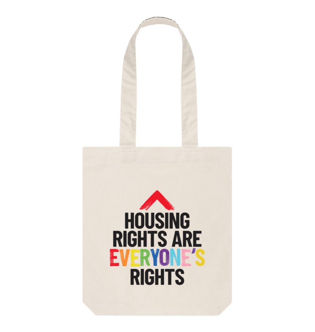 Natural canvas colour tote bag with slogan "Housing rights are everyone's rights" The word everyone's is in the LGBTQ+ flag colours