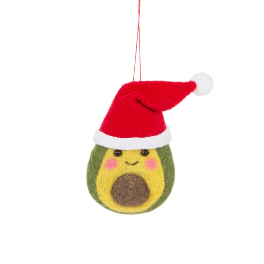 A green, yellow and brown felt avocado wearing a red and white Christmas Santa hat. The avocado is smiling, with pink rosy cheeks. The felt avocado hangs from a red string against a white background.
