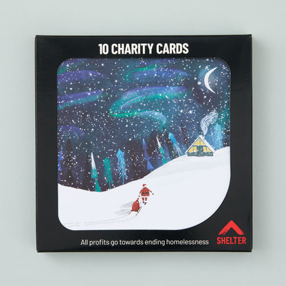 Pack of 10 'North Pole Night' Christmas cards in a black Shelter branded card box. 