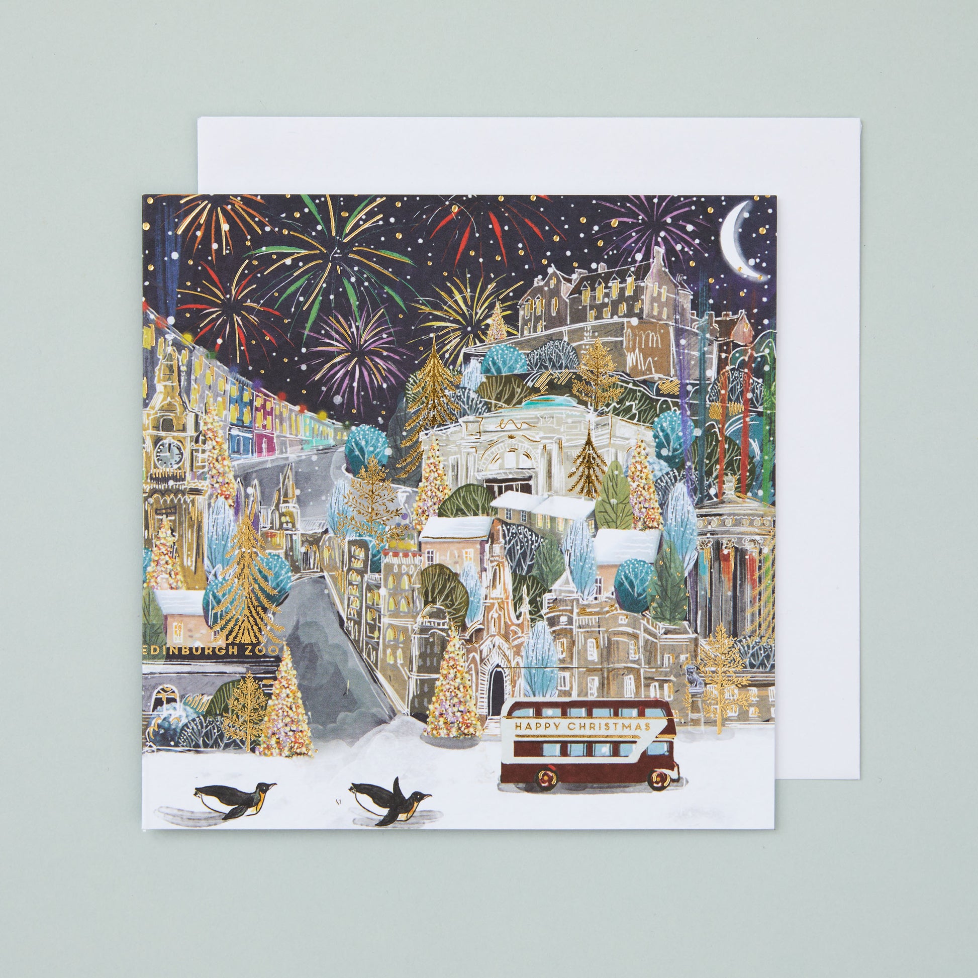 A square Christmas card with an illustration of a festive Edinburgh, with fireworks in the sky.