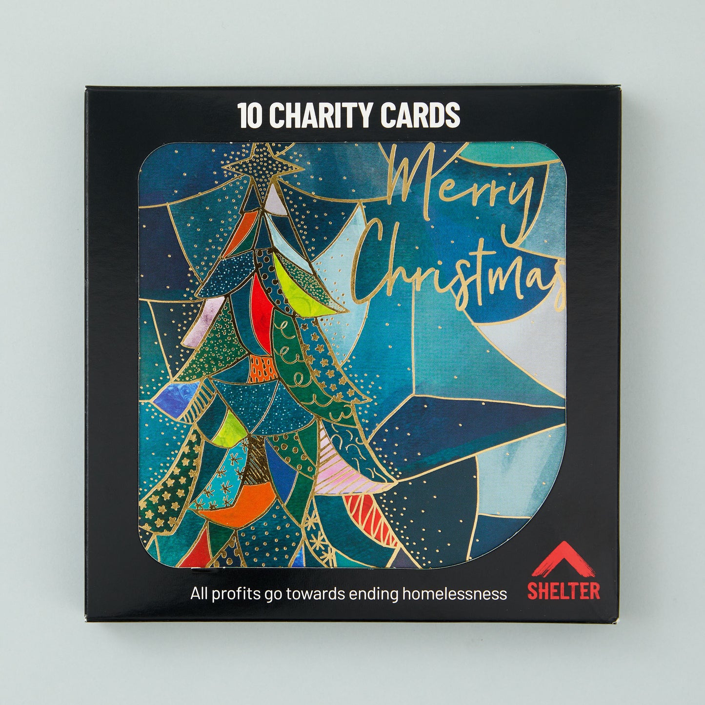 Pack of 10 'Stained Glass Tree' Christmas cards in a black Shelter branded card box. 