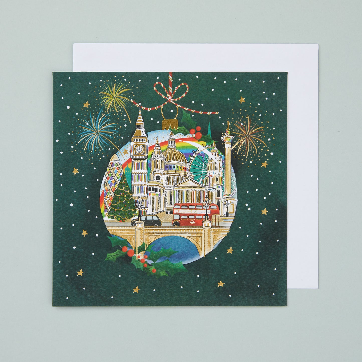 A square Christmas card with an illustration depicting famous London landmarks in a bauble design on a festive green background.