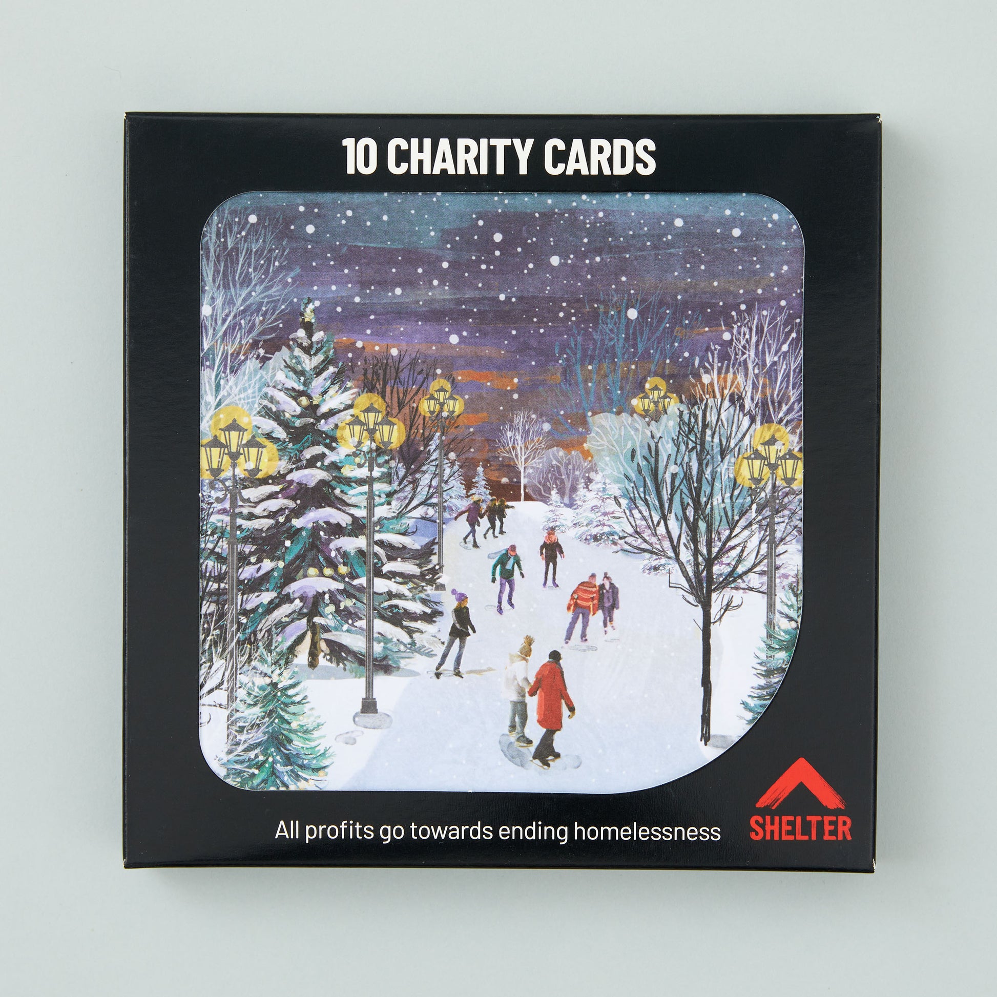 Pack of 10 'Skating on the Stream' Christmas cards in a black Shelter branded card box. 