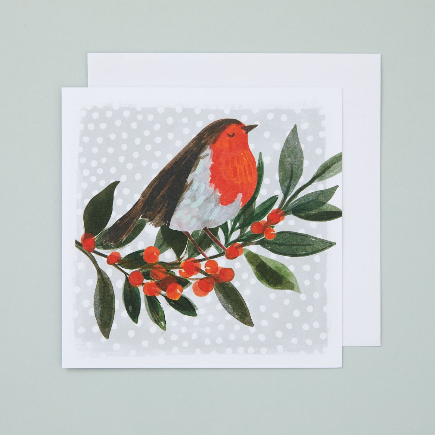 A square Christmas card with an illustration depicting a robin sitting on a branch with red berries.