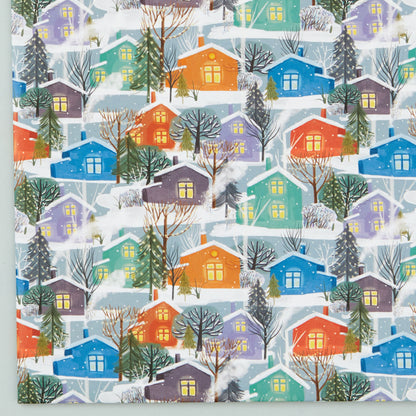 Close up of the Nordic Houses design - colourful cabins in a snowy forest landscape.