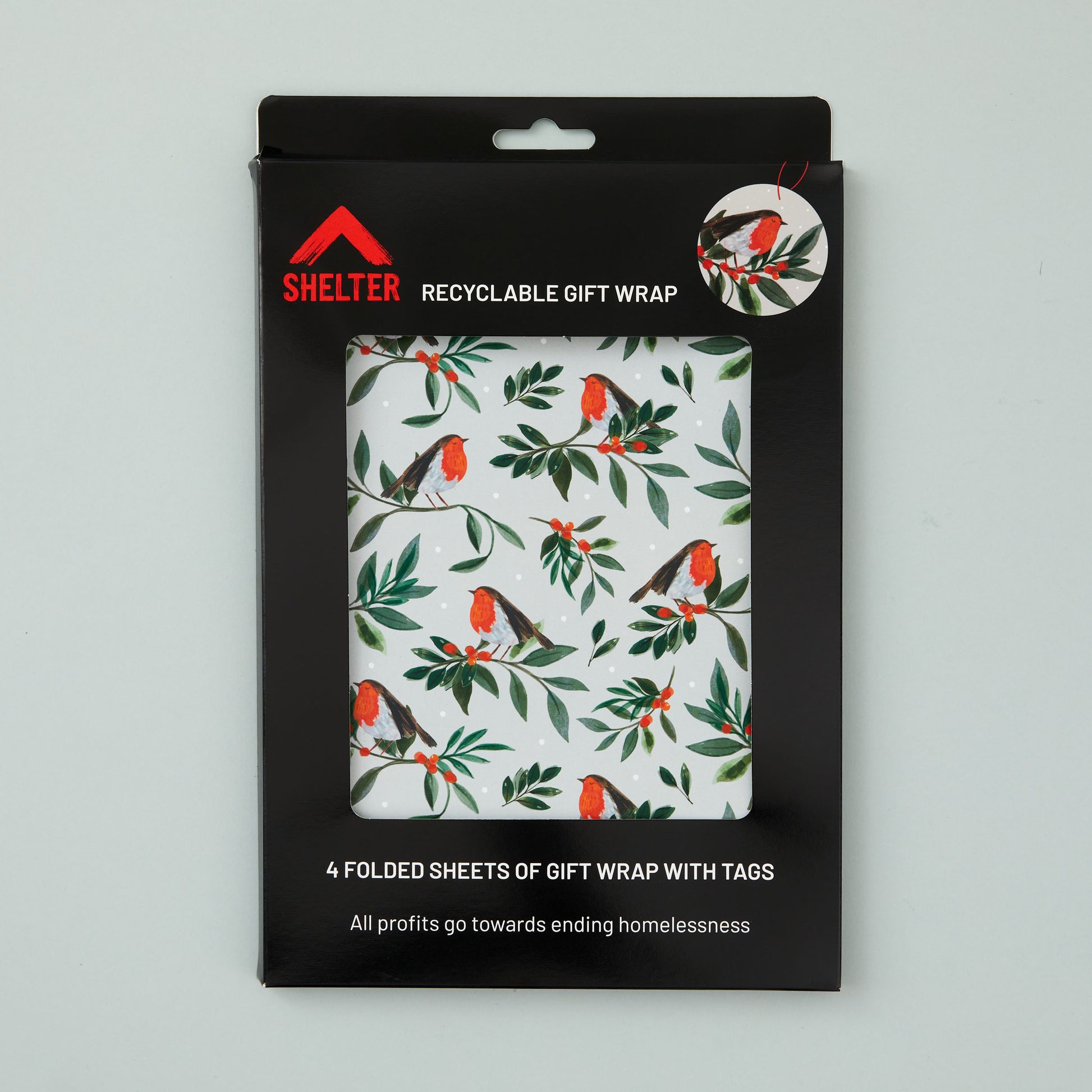 Pack of four sheets of gift wrap and matching tags packaged in a card Shelter branded box. 