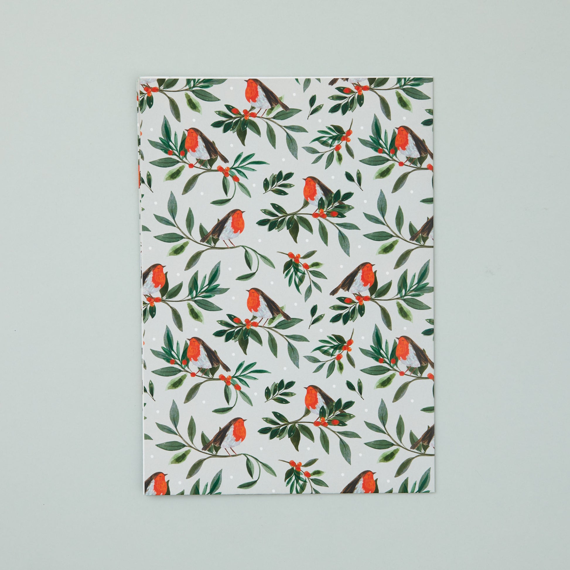 A sheet of 'Berry Bough' robin wrapping paper.