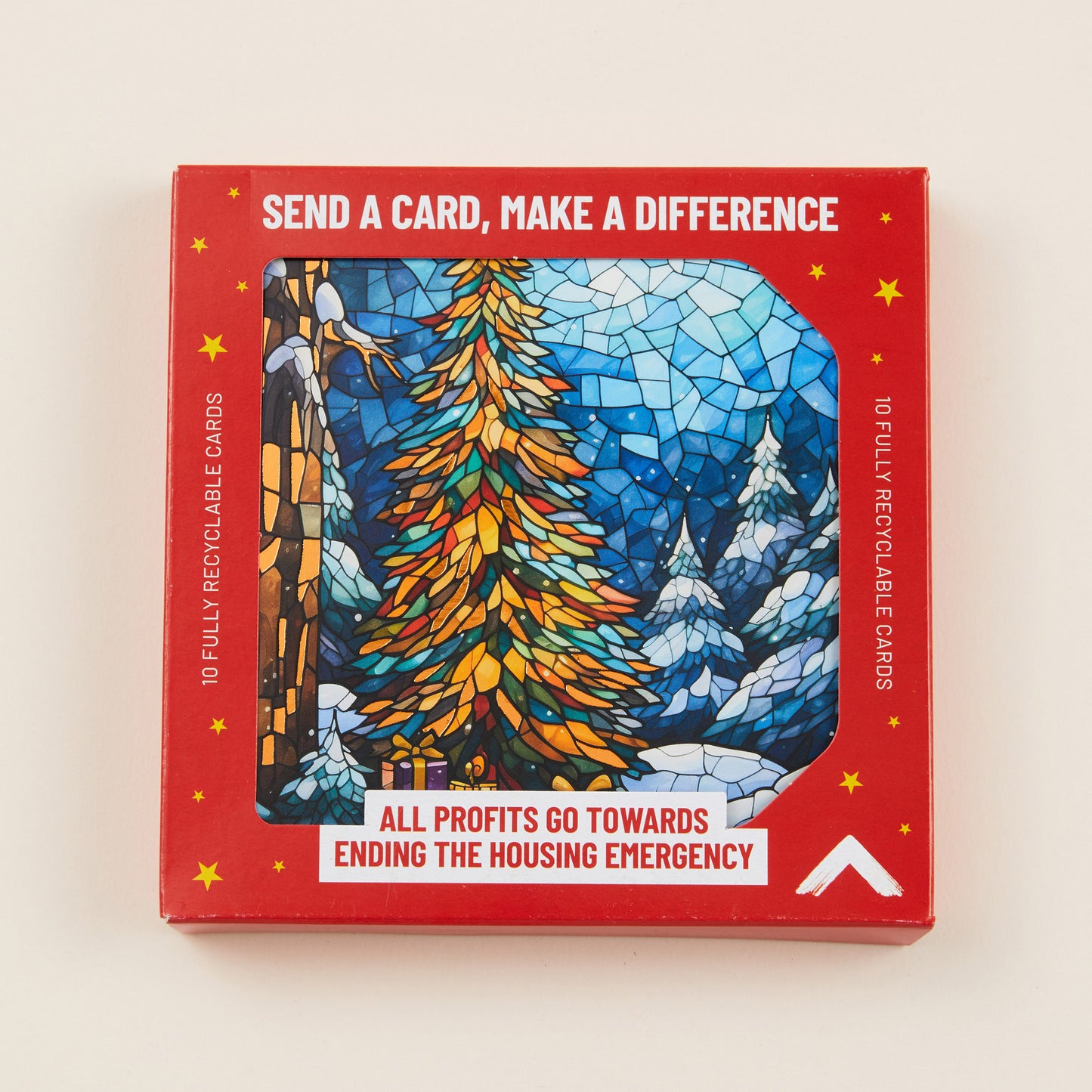 Stylized snowy winter scene with trees on the front of a Christmas card, the card shown in red cardboard packaging with the title: 'Send a card, make a difference'