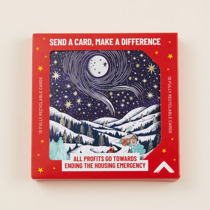 A Christmas card with a snowy mountainous scene on the front, the card shown in red cardboard packaging with the title: 'Send a card, make a difference'