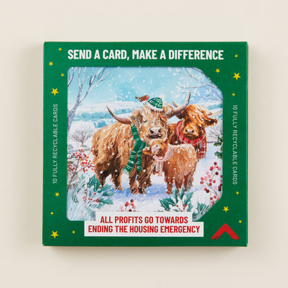 A Christmas card with highland cows in the snow on the front, the card shown in green cardboard packaging with the title: 'Send a card, make a difference'