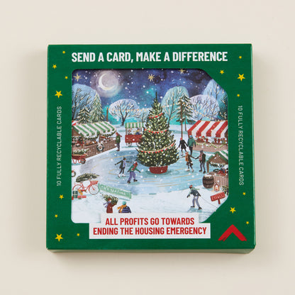 Box of Christmas cards with a winter scene illustration on a beige background