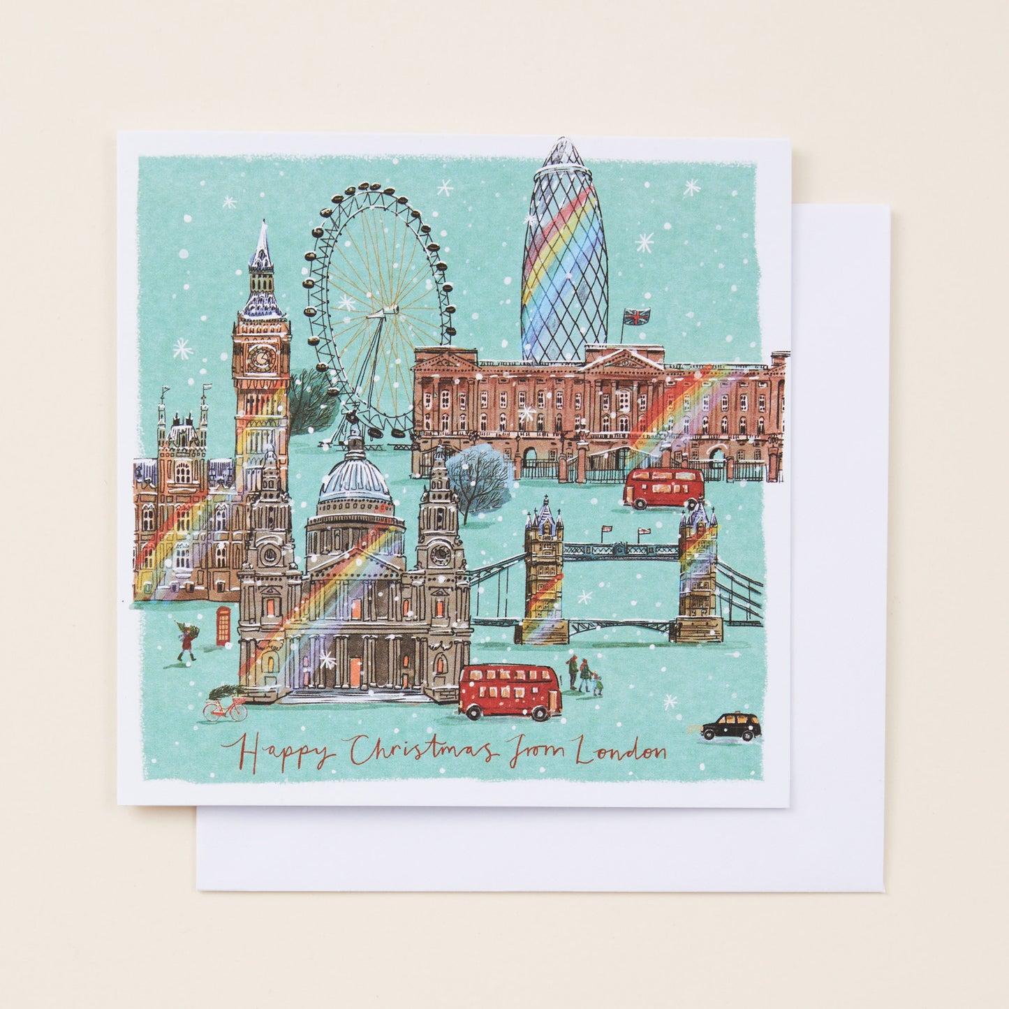 Christmas card with London landmarks including Big Ben, the Eye, and Tower Bridge on a light blue background.