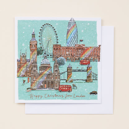 Christmas card with London landmarks including Big Ben, the Eye, and Tower Bridge on a light blue background.