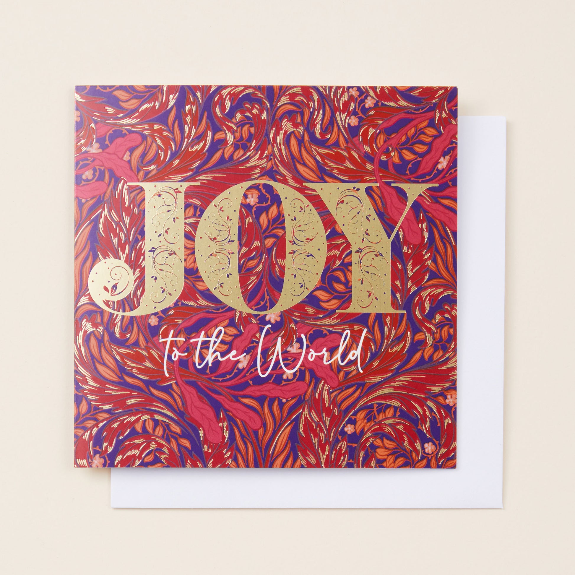 Christmas card with 'Joy to the World' text on a red and blue patterned background