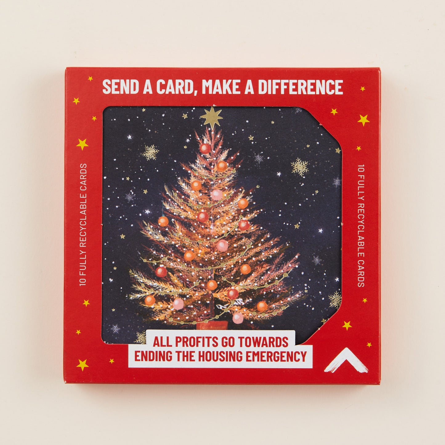 Red box of Christmas cards with a tree design and text on a beige background