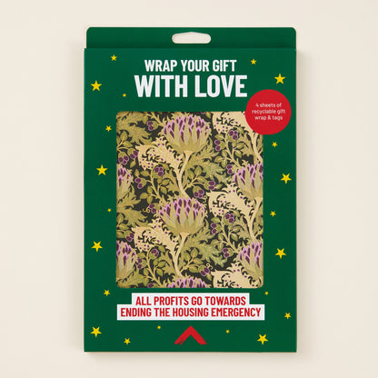 Packaging of gift wrap with floral design and text on a beige background