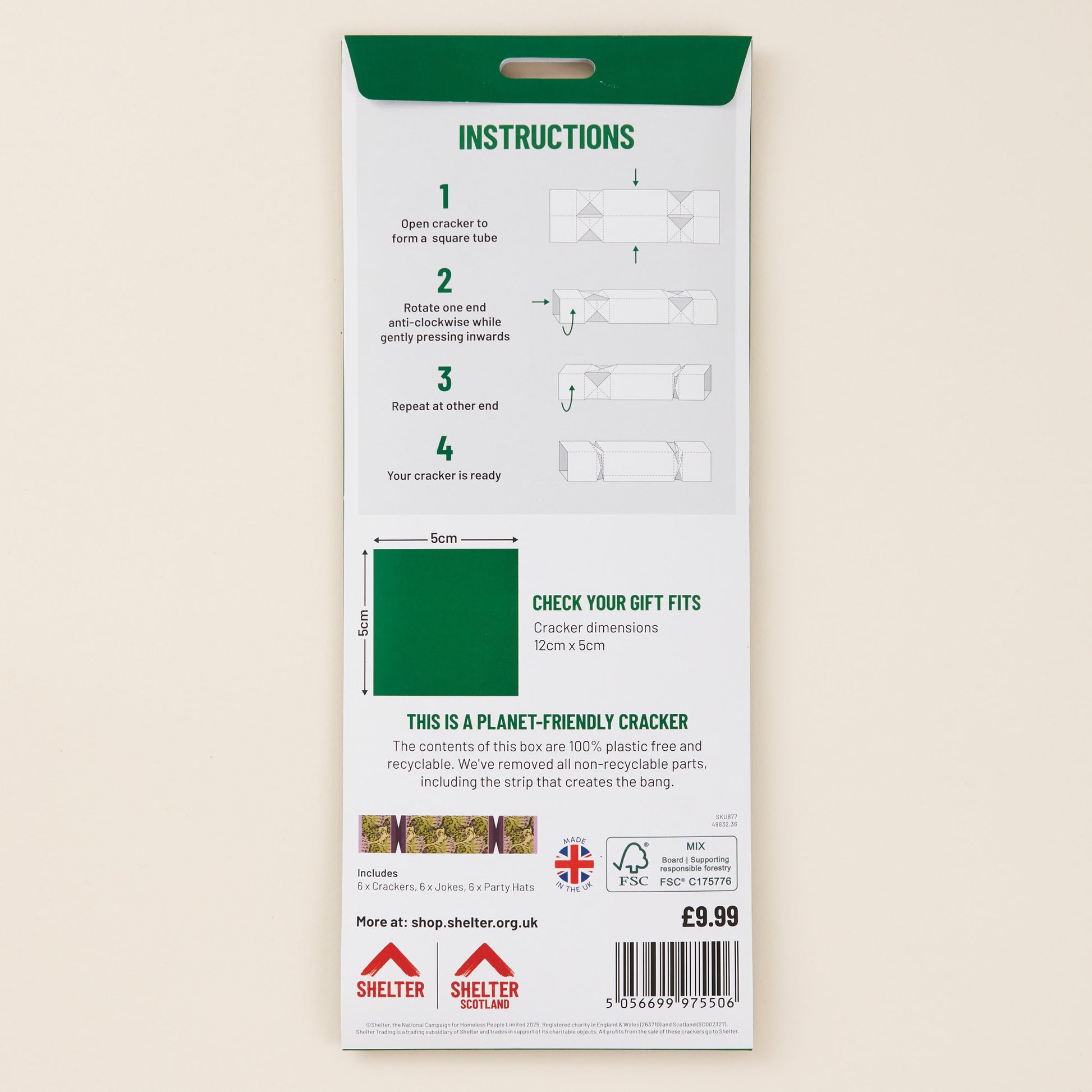 Christmas cracker packaging with instructions and branding on a beige background