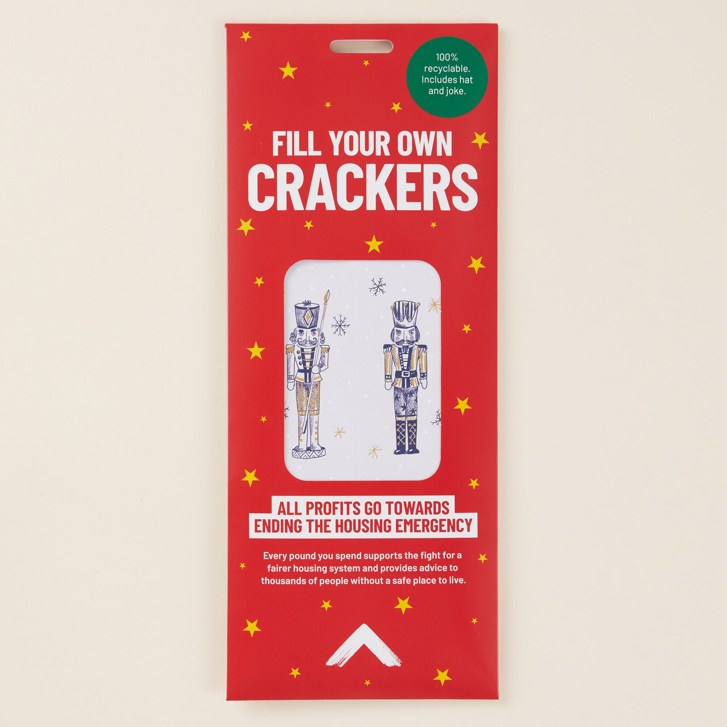 Red packaging for 'Fill Your Own Crackers' with illustrations of nutcrackers on a beige background.
