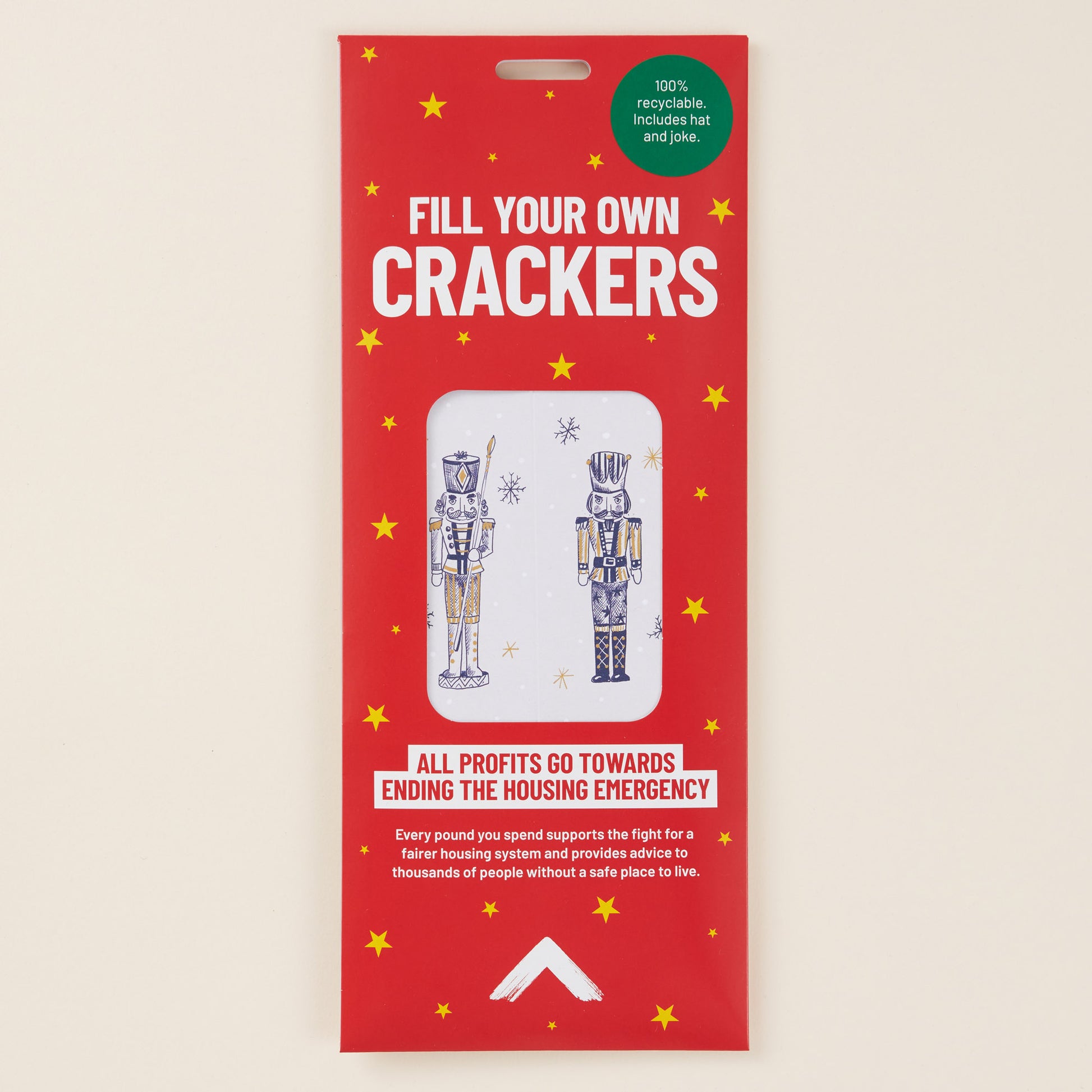 Red packaging for 'Fill Your Own Crackers' with illustrations of nutcrackers on a beige background.