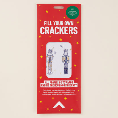 Red packaging for 'Fill Your Own Crackers' with illustrations of nutcrackers on a beige background.