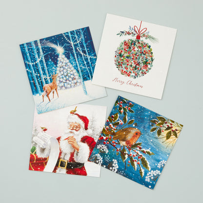 Four square Christmas cards in different designs - one with a reindeer and tree, one with a bauble design, one with a Santa design and one with a robin. 