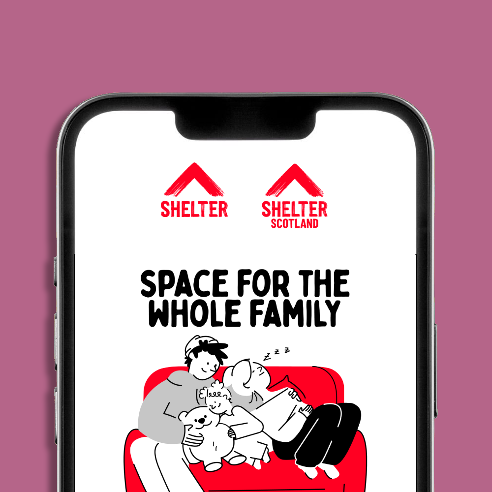 A smartphone mockup displaying the Shelter and Shelter Scotland logos and an eCard on screen. The eCard has text 'SPACE FOR THE WHOLE FAMILY', and a cartoon illustration of a family and dog cuddling on a red sofa.