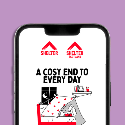 A smartphone mockup displaying the Shelter and Shelter Scotland logos and an eCard design. The eCard has text 'A COSY END TO EVERY DAY', and a cozy illustration of a child reading under a red and white blanket with heart patterns.