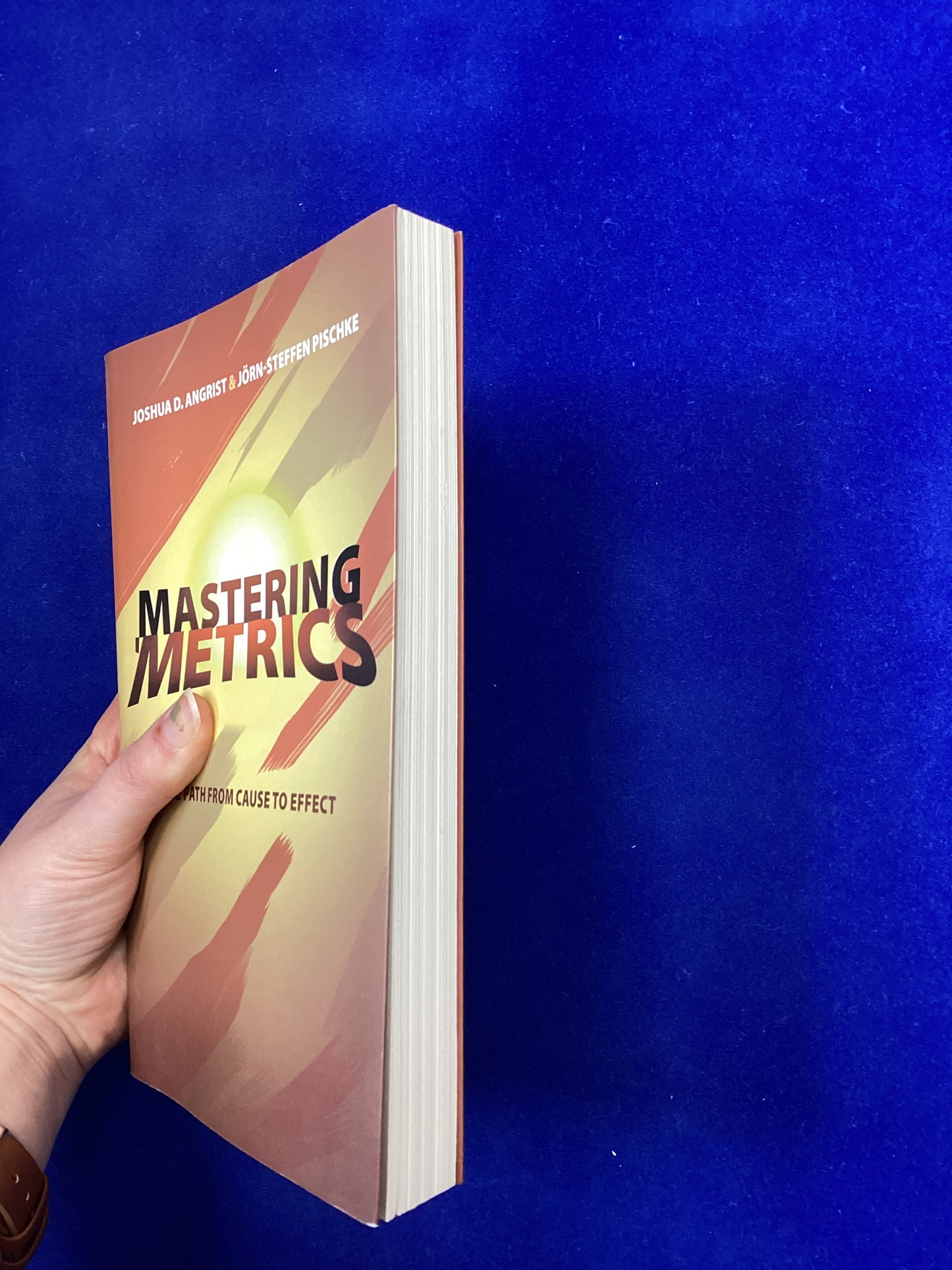 Mastering Metrics: the path from cause to effect, J.D. Angrist & J Pischke, 2015.